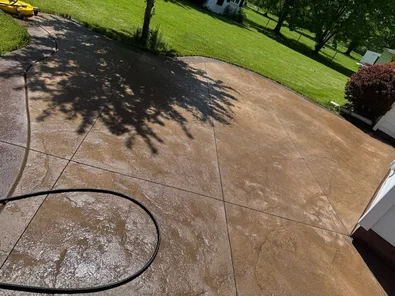 Patio after pressure washing, surface restored